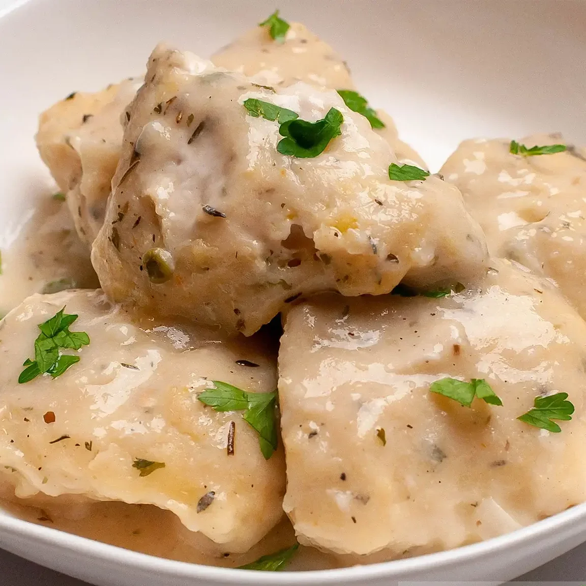 "Homemade Bisquick dumplings in a stew"